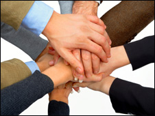 A team bringing their hands together