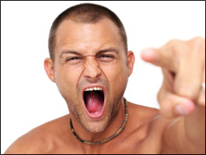 A young man pointing and shouting