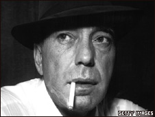 Film star Humphrey Bogart smoking a cigarette