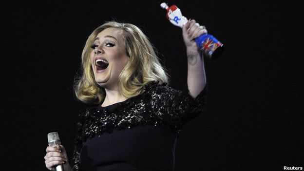 Adele holds her award for best British album of the year during the Brit Awards.