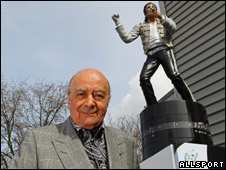 Mohammed Al Fayed below the statue of Michael Jackson, at Fulham FC